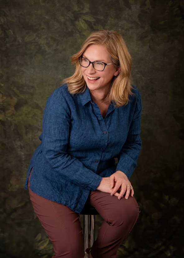 Colleen Godfrey playfully looks over shoulder